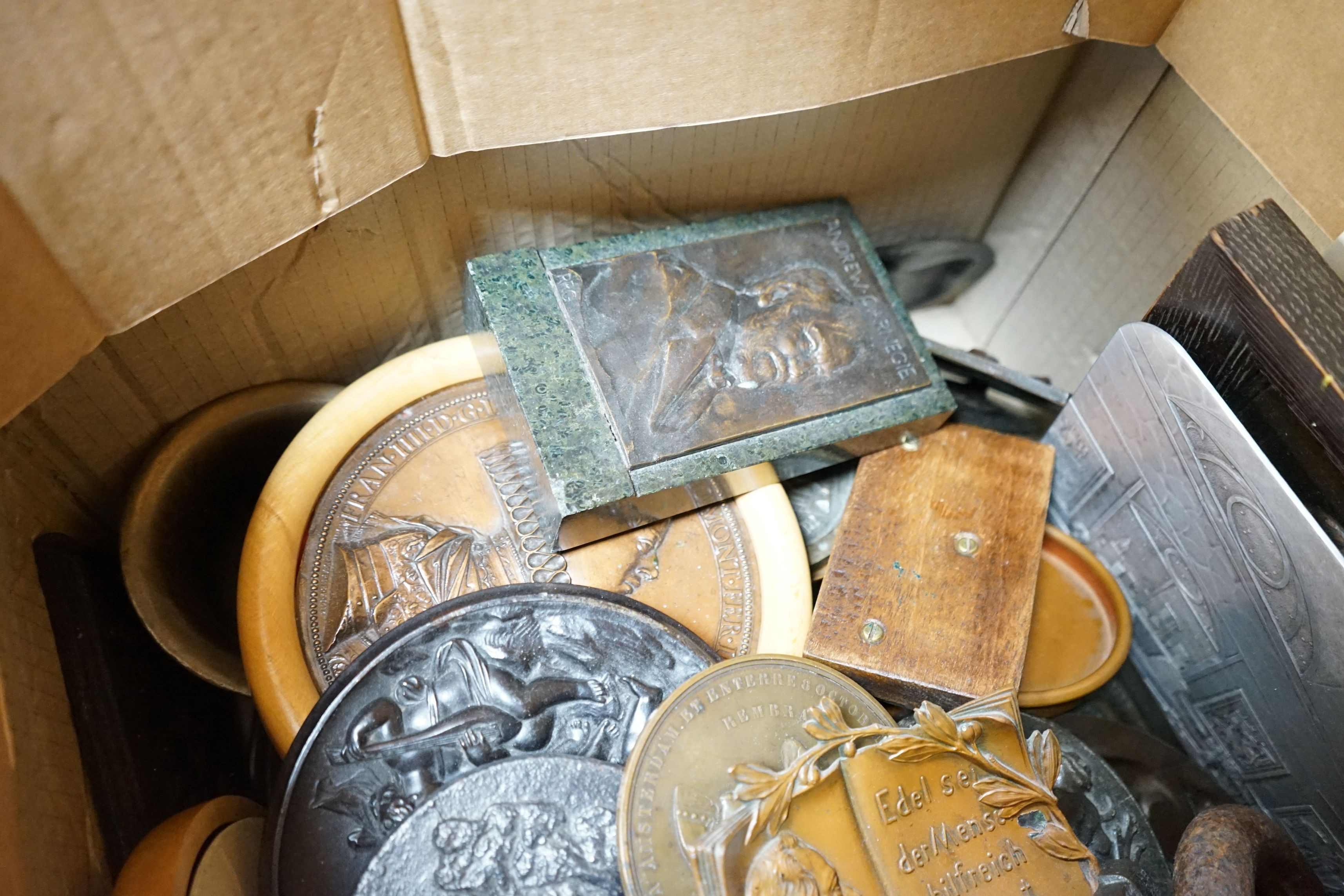 A large collection of mixed decorative metal plaques